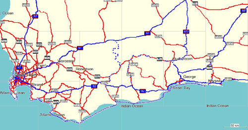 Map showing road network with blue and red lines marking different routes across a coastal region with water visible at bottom