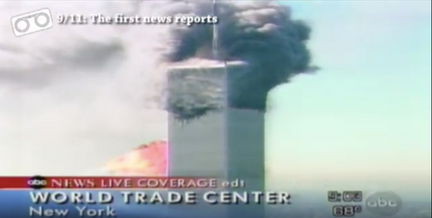 Screenshot of TV news coverage showing the Twin Towers with smoke and fire, ABC News Live Coverage banner visible