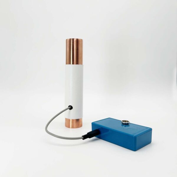 White cylindrical tube with copper-colored metal ends connected by gray cable to blue rectangular control box on white background