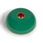 Round green orgonite disc with copper-colored center hole, viewed from above on white background