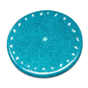 Round turquoise charging plate with glittery surface, white dots around perimeter, and small star shape in center