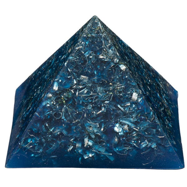 Blue orgonite pyramid with metallic shavings and crystals embedded throughout, photographed against white background